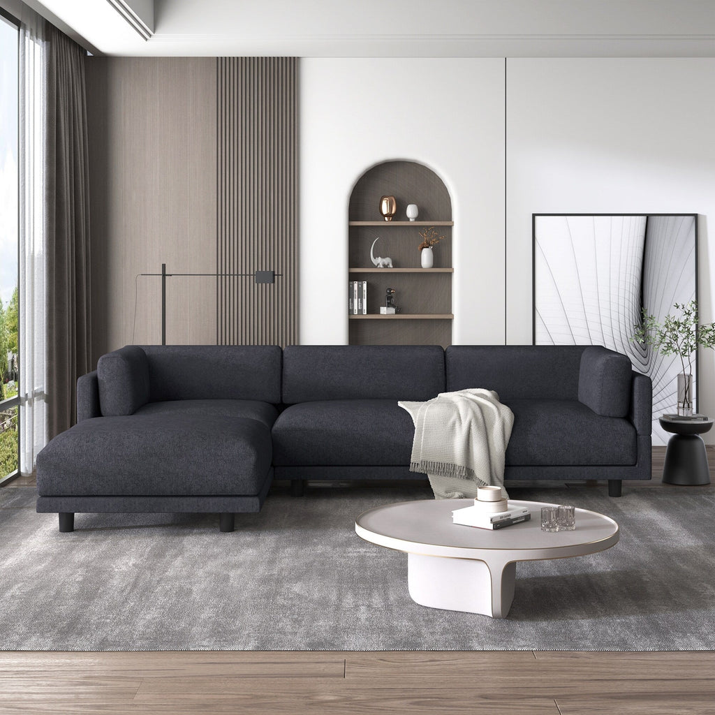 Canapé en forme de L de 260 cm en polyester avec pouf réversible.