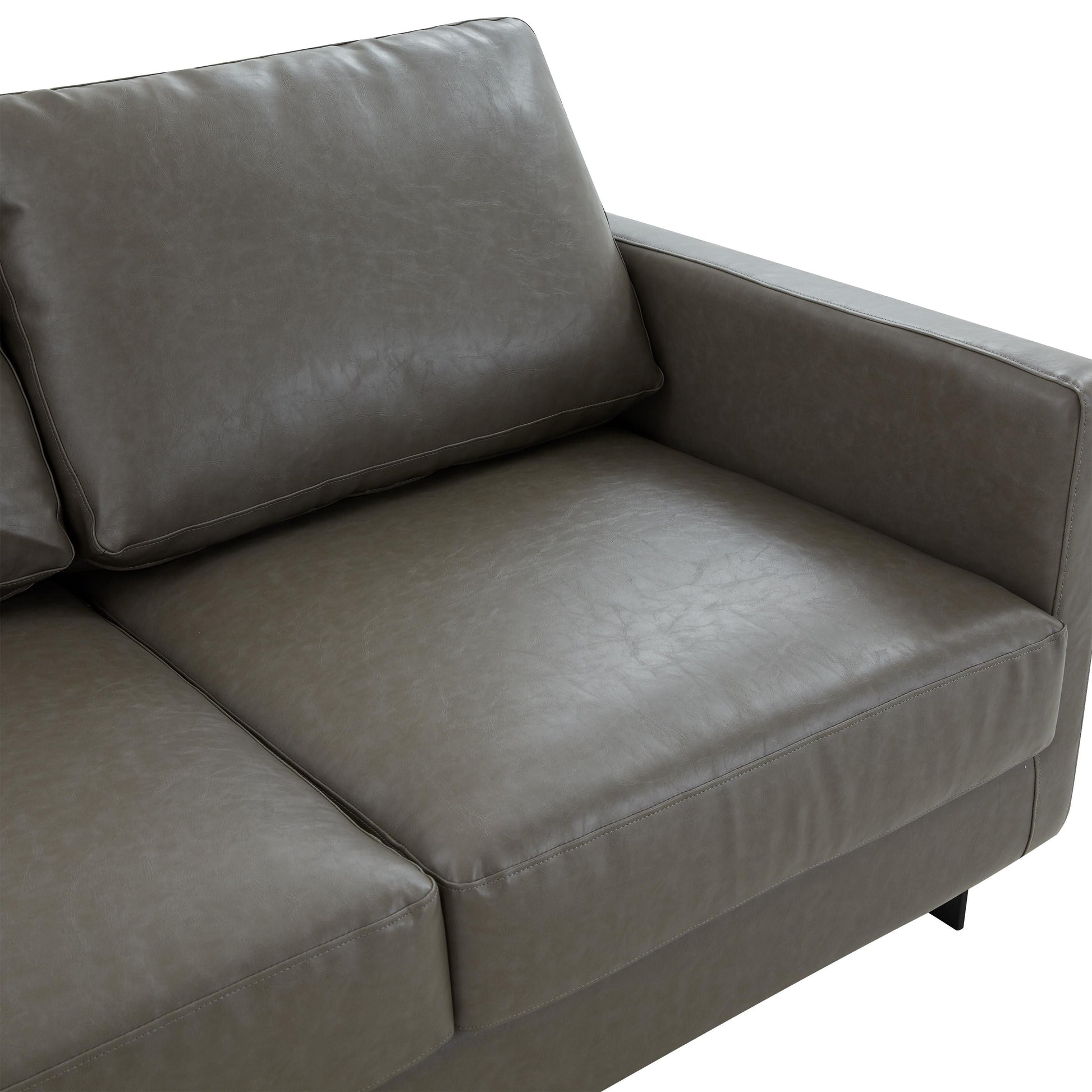 Canapé 3 places, style minimaliste, revêtement cuir, avec coussins amovibles, en acier inoxydable, pour salon ou chambre à coucher.
